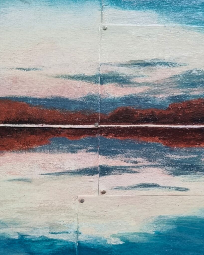 Malerei eines Sonnenaufgangs mit Spiegelung im Wasser. Künstlerin Annett Wagner